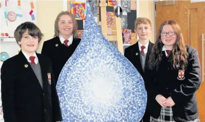  ??  ?? ●● Henry Johnson, Clare Mottram, Simon Price and Hollie Harris from All Hallows with the antibullyi­ng teardrop mural