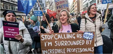  ?? ?? Pay dispute: Striking nurses and their supporters march through London last month