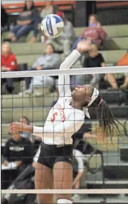  ??  ?? LaFayette junior Imani Cook goes up for a kill during an opening-round state playoff match against North Oconee on Saturday. The Lady Ramblers swept the best-of-five match and will host Eastside on Wednesday of this week.