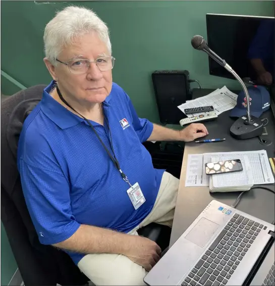  ?? COURTESY PHOTO ?? Former Sun sportswrit­er Chaz Scoggins gets ready to officially score the last of his 1,895MLB games at Fenway Park on Oct. 5.