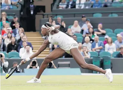  ?? ALASTAIR GRANT/AP ?? Cori “Coco” Gauff returns a shot to Magdalena Rybaikova in a singles match Wednesday during Day 3 at Wimbledon.