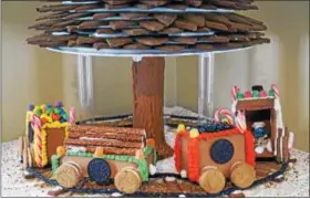  ?? PHOTOS BY EMILY RYAN ?? Baker Smurf lends a whimsical touch to Hagley’s gingerbrea­d train.