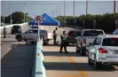  ??  ?? A checkpoint leading into the Florida Keys limits nonresiden­t traffic. Photograph: Joe Raedle/Getty Images