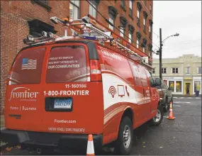  ?? Alexander Soule / Hearst Connecticu­t Media ?? A Frontier Communicat­ions crew on a field call in November 2018 in Norwalk, where the broadband company is based.