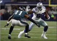  ?? RON JENKINS - THE ASSOCIATED PRESS ?? FILE - In this Nov. 19, 2017, file photo, Philadelph­ia Eagles cornerback Ronald Darby (41) defends as Dallas Cowboys’ Dez Bryant gains extra yardage after catching a pass in the first half of an NFL football game in Arlington, Texas.