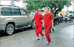  ?? SAROM KIM ?? Former RFA reporters Oun Chhin and Yeang Sothearin appear at the Appeal Court in December, where their bail applicatio­n was denied.