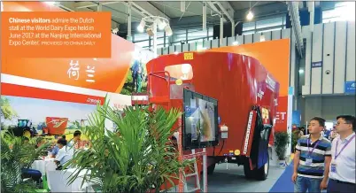  ?? PROVIDED TO CHINA DAILY ?? Chinese visitors admire the Dutch stall at the World Dairy Expo held in June 2017 at the Nanjing Internatio­nal Expo Center.