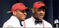  ?? AP/DAVID TULIS ?? Robert Nkemdiche (right), the nation’s top recruit, is congratula­ted by his brother Denzel after signing a national letter of intent to play football for Ole Miss, where Denzel already plays. Nkemdiche’s signing in Grayson, Ga., capped a big day for...
