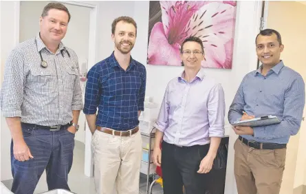  ?? Picture: Kevin Farmer ?? NEW LOOK: Village Medical Centre doctors (from left) Dr Nick Meyers, Dr Kyle Johnston, Dr Roland Owen and Dr Majid Ali are celebratin­g the expanded Highfields facility.