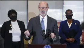  ?? BEN HASTY — MEDIANEWS GROUP ?? Pennsylvan­ia Gov. Tom Wolf speaks during the press conference. Back from left are Mary Kargbo, President/CEO, Berks Community Health Center, and Dr. Denise Johnson, Pennsylvan­ia Physician General. During a visit by Pennsylvan­ia Gov. Tom Wolf to the Berks Community Health Center Rockland Street location Wednesday morning ahead of a vaccine clinic at the Health Center later in the day.