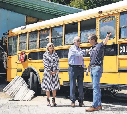  ?? EVAN VUCCI/ AP ?? President Joe Biden, first lady Jill Biden and Kentucky Gov. Andy Beshear tour areas damaged by flooding in Lost Creek, Ky., where a bus floated into a building. At least 37 people have died in flash flooding in Kentucky.