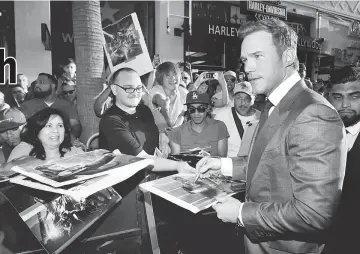  ??  ?? Pratt signs autographs at the world premiere of ‘Guardians of the Galaxy Vol. 2.’ in Hollywood, California, last month. — Reuters file photo