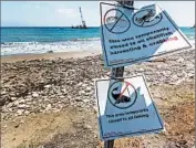  ?? DAMIAN DOVARGANES/AP ?? Signs by the California Department of Fish and Game mark areas closed off by an oil spill north of Goleta, Calif.