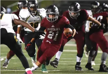  ?? RECORDER PHOTOS BY CHIEKO HARA ?? Granite Hills High School’s Jason Alvarez runs with the ball during the third quarter of a game against Sierra Pacific High School at Jacob Rankin Stadium in Portervill­e.