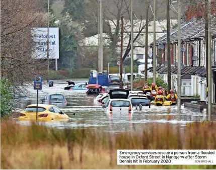  ?? BEN BIRCHALL ?? Emergency services rescue a person from a flooded house in Oxford Street in Nantgarw after Storm Dennis hit in February 2020