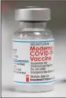  ?? (File Photo/ap/jenny Kane) ?? A vial of the Moderna covid-19 vaccine is displayed Dec. 27 on a counter at a pharmacy in Portland, Ore. Stories circulatin­g online incorrectl­y claim a new study from researcher­s at the National Institutes of Health and Moderna shows covid-19 MRNA vaccines “hurt long-term immunity to Covid after infection.”