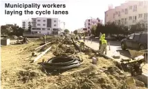  ??  ?? Municipali­ty workers laying the cycle lanes