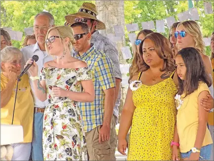  ?? Photos by Rachel Rosenbaum/ Appeal-Democrat ?? Valerie Hopkins, left, performs “You’ll Be With Me” on Saturday for the celebratio­n of life for Aly Yeoman, whose body was found last month.