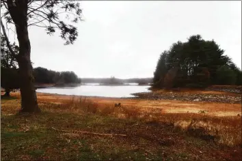  ?? Ned Gerard / Hearst Connecticu­t Media ?? Water levels remained low on the Trap Falls Reservoir in late November in Shelton. Parts of four counties are still “abnormally dry,” even as rainfall the past three months exceeded season averages in most areas.