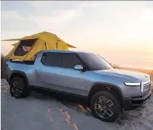  ??  ?? The Rivian R1T pickup features a futuristic design and a 640-km range.