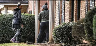  ?? JOHN SPINK/AJC 2021 ?? Blaise Barnett’s aunt, Jada Miller (left), and mother, Deonna Bray, await news Nov. 10 on Blaise, a 1-year old taken when the vehicle he was in was stolen while his parents were unloading groceries in front of their Clarkston apartment. Blaise was missing for more than 36 hours before he was found.