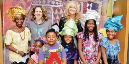  ?? SUBMITTED PHOTO ?? Bring on the Sunshine’s fashion show is a crowd favourite. Here, Stella, far left, decks out some young volunteers in African fashions.