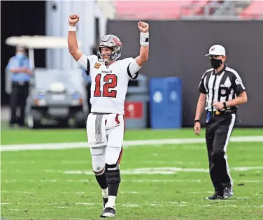  ?? GETTY IMAGES ?? Tom Brady celebrates after Tampa Bay’s victory over the Los Angeles Chargers on Sunday. The Packers have a bye in Week 5, then face Brady and the Buccaneers on Oct. 18 in Tampa.