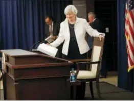  ?? PABLO MARTINEZ MONSIVAIS — THE ASSOCIATED PRESS ?? Federal Reserve Chair Janet Yellen takes her seat before speaking during a news conference following the Federal Open Market Committee meeting in Washington, Wednesday.