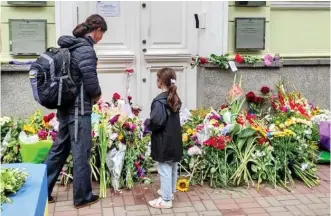  ?? ?? Remembranc­e: Floral tributes outside the British Embassy in Kyiv yesterday