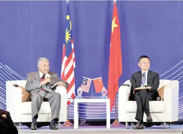  ??  ?? Prime Minister Tun Dr Mahathir Mohamad and China Entreprene­ur Club chairman Jack Ma during the dialogue session at the China Entreprene­ur Leaders Forum yesterday.