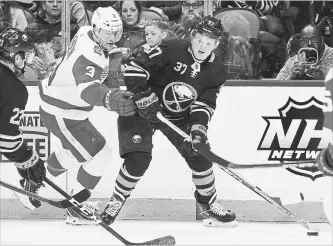  ?? CANADIAN PRESS FILE PHOTO ?? Sabres forward Casey Mittelstad­t skates past Detroit Red Wings defenceman Nick Jensen in Buffalo in March. The rookie played six games for the Sabres at the end of the National Hockey League season.