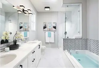  ??  ?? A deep soAker tuB, Custom glAss shower And AttrACtive tile work set A spA-like AmBienCe in the mAster ensuite.