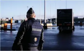  ?? Photograph: Kenzo Tribouilla­rd/AFP/Getty Images ?? A Belgian customs officer in the port of Zeebrugge. Businesses are having to pay increased charges to cover administra­tion after Brexit, putting pressure on the viability of exporting to the EU.