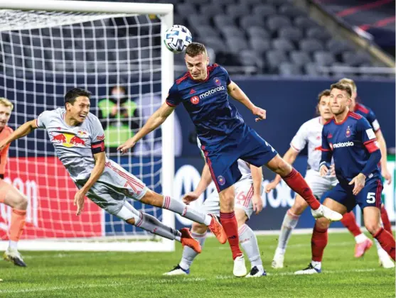  ?? CHICAGO FIRE FC ?? Defender Boris Sekulic, who assisted on Robert Beric’s goal in the 51st minute, puts a shot on goal against the New York Red Bulls after a corner kick Saturday.