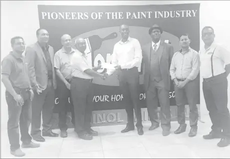  ??  ?? Torginol Paints Production Manager, Fenton Persaud hands over the sponsorshi­p cheque to Lusignan Golf Club president Aleem Hussain in the presence of Company Secretary, Mohamed S. Ally, Marketing and Sales Manager, Rudy Jairam, PRO of the LGC, Guy...