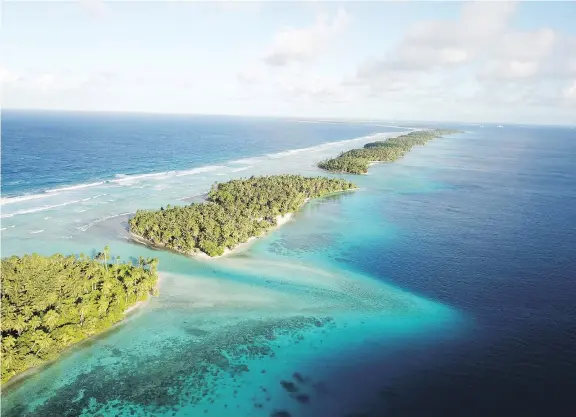  ?? PHOTOS: NICOLE EVATT/THE ASSOCIATED PRESS ?? Coral atolls separate the ocean from the lagoon in the Republic of the Marshall Islands, which is a 4 1/2-hour flight from Honolulu.