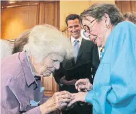  ?? TRIBUNE NEWS SERVICE FILE PHOTO ?? Del Martin, left, and Phyllis Lyon exchange rings as they are married by then-San Francisco mayor Gavin Newsom in 2008, becoming the first same-sex couple to be married in San Francisco.