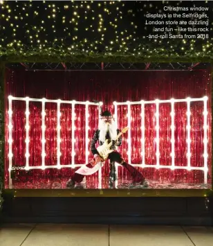  ??  ?? Christmas window displays in the Selfridges, London store are dazzling and fun – like this rock -and-roll Santa from 2018