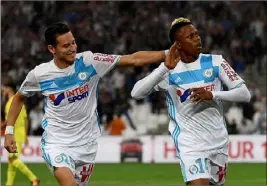  ?? (Photo AFP) ?? Florian Thauvin et Clinton Njie commencent à trouver leurs automatism­es.