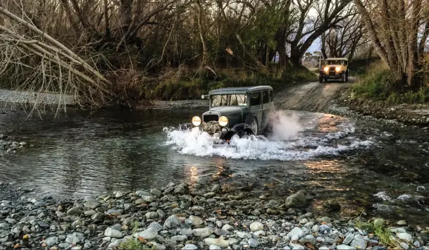  ??  ?? River crossings — or fords — are a common obstacle on the Irishman. Well-equipped cars have sacks across the grille to prevent the sudden drenching of the fan, and fan belts are usually removed prior to crossings Sunglasses, beards, beers, side exhaust, and a bit of roadkill — the Irishman Rally attracts all sorts! A keen sense of humour can be found among the guys and girls who participat­e, also manifested in their cars. This Model A tourer carried vintage skis, a campfire billy, and a dead wallaby