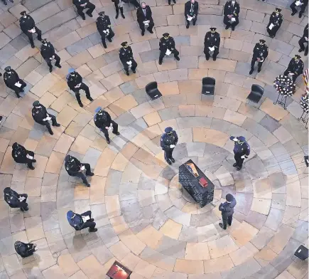  ?? POOL PHOTO BY KEVIN DIETSCH ?? A memorial service is held for Capitol Police officer Brian Sicknick lying in honor in the Rotunda of the U. S. Capitol on Wednesday. Sicknick died after being injured in the attack on the Capitol on Jan. 6.