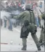  ?? PHIL CARPENTER THE GAZETTE ?? SQ officer fires a gas grenade during demonstrat­ions Friday in Victoriavi­lle.