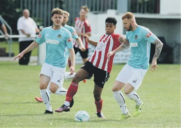  ?? ?? Sunderland RCA (red-and-white) beat Hebburn Town last week in the FA Cup.