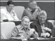  ?? AP/ISMAEL FRANCISCO ?? Cuban President Raul Castro (left) and heir-apparent Miguel Diaz-Canel attend a twice-annual legislativ­e session at the National Assembly in Havana in December 2014.