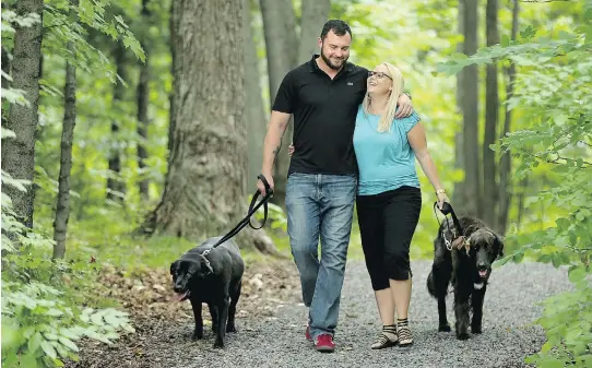  ?? JULIE OLIVER / OTTAWA CITIZEN ?? Jody Mitic, now an Ottawa city councillor, and his wife Alannah Gilmore. Mitic’s new book on his life as a sniper will be released on Tuesday.