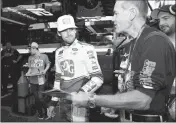  ?? ASSOCIATED PRESS ?? RYAN BLANEY SIGNS for fans before practice for the NASCAR Cup series auto race Saturday at Dover Internatio­nal Speedway in Dover, Del.