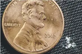  ?? U.S. DRUG ENFORCEMEN­T ADMINISTRA­TION ?? Two milligrams of fentanyl — a potentiall­y fatal dose, according to the U.S. Centers for Disease Control and Prevention — is positioned next to a penny.