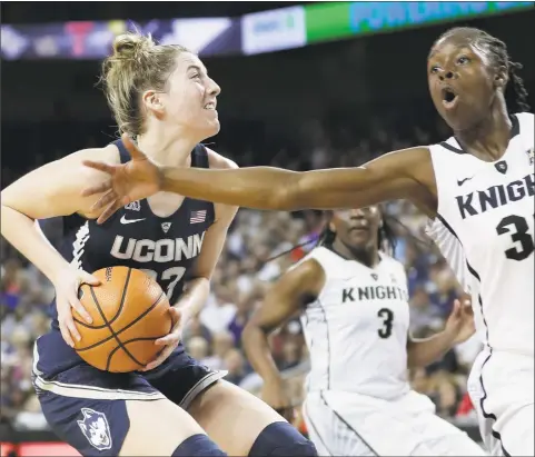  ?? John Raoux / Associated Press ?? UConn’s Katie Lou Samuelson, left, has a past with Louisville standout Asia Durr. The Huskies host the Cardinals Monday at 7 p.m.