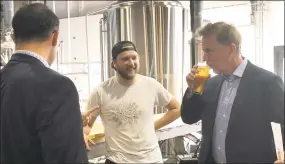  ?? Kaitlyn Krasselt / Contribute­d photo ?? Ned Lamont, Democratic nominee for governor, samples beer at Tribus Beer Co. as brewery co-founder Matt Weichner looks on.