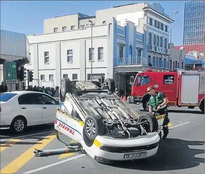  ?? Picture: SUPPLIED ?? SUDDEN INVERSION: A BCM traffic vehicle lies upside down after being involved in a collision in Oxford Street yesterday. Several vehicles were damaged